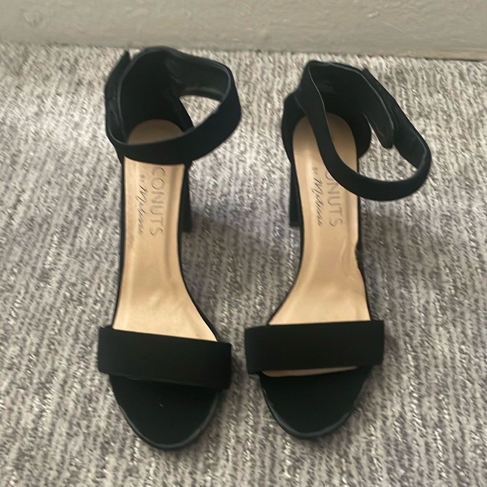 Size 9 black two strap heels. Used and in good condition.